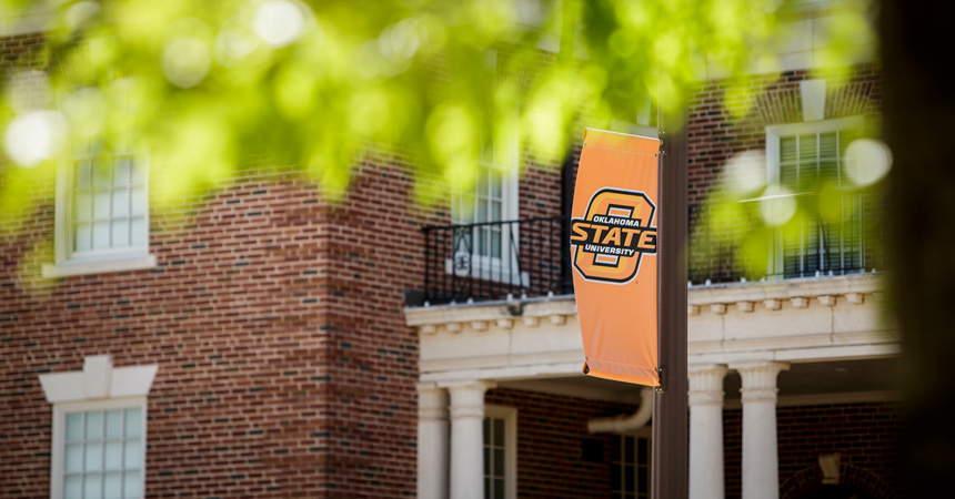 Spring campus photo with OSU banner
