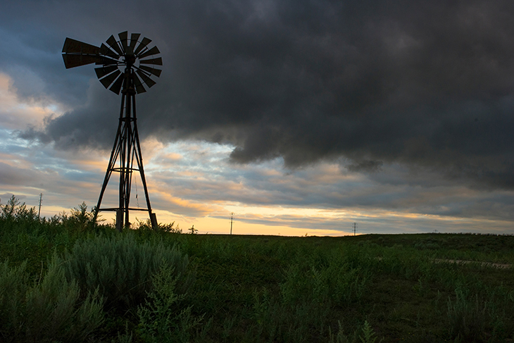 Windmill on Oklahoma prairie at dusk