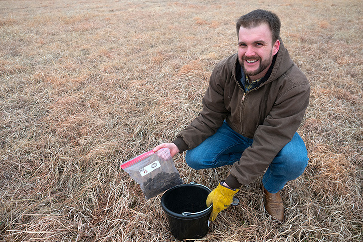 Photo of Shannon Mallory taking a soil sample.