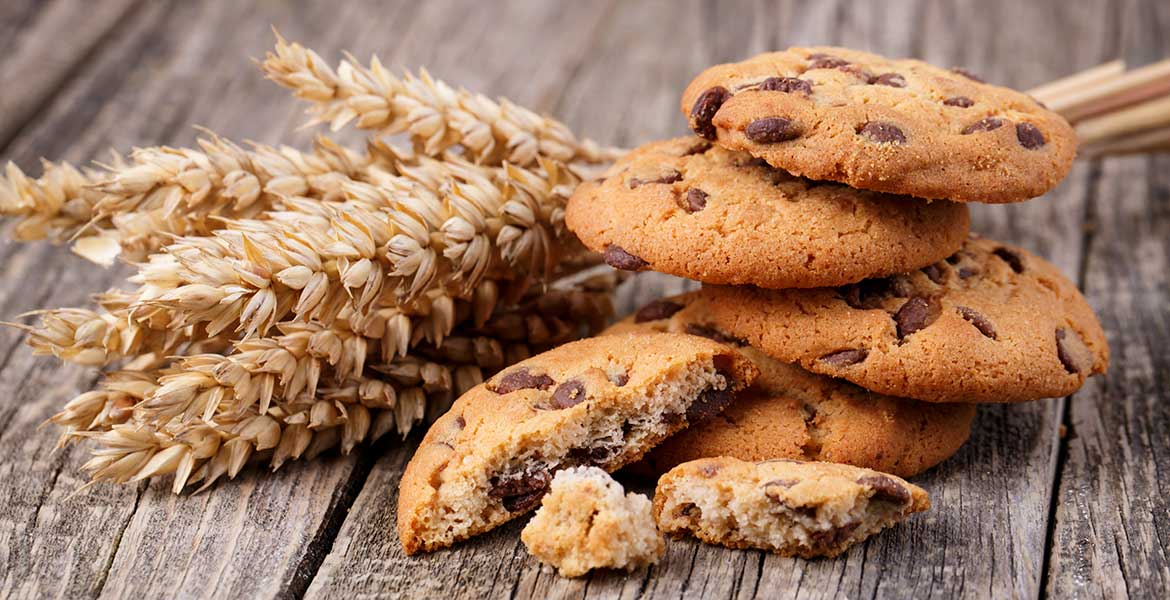 wheat with chocolate chip cookies on wooden table
