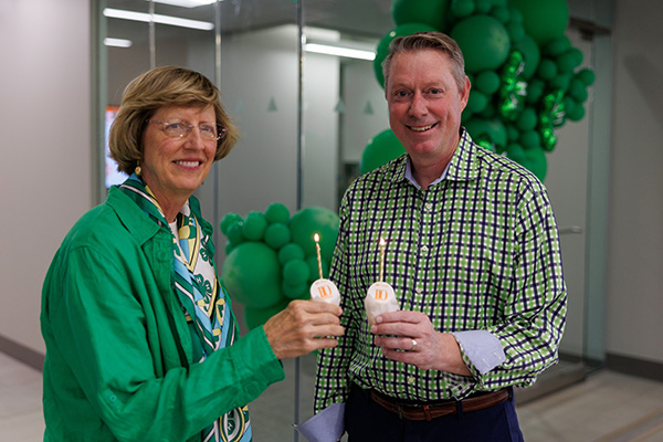 Damona Doye and Jayson Lusk with OSU Extension 110th Anniversary cupcakes