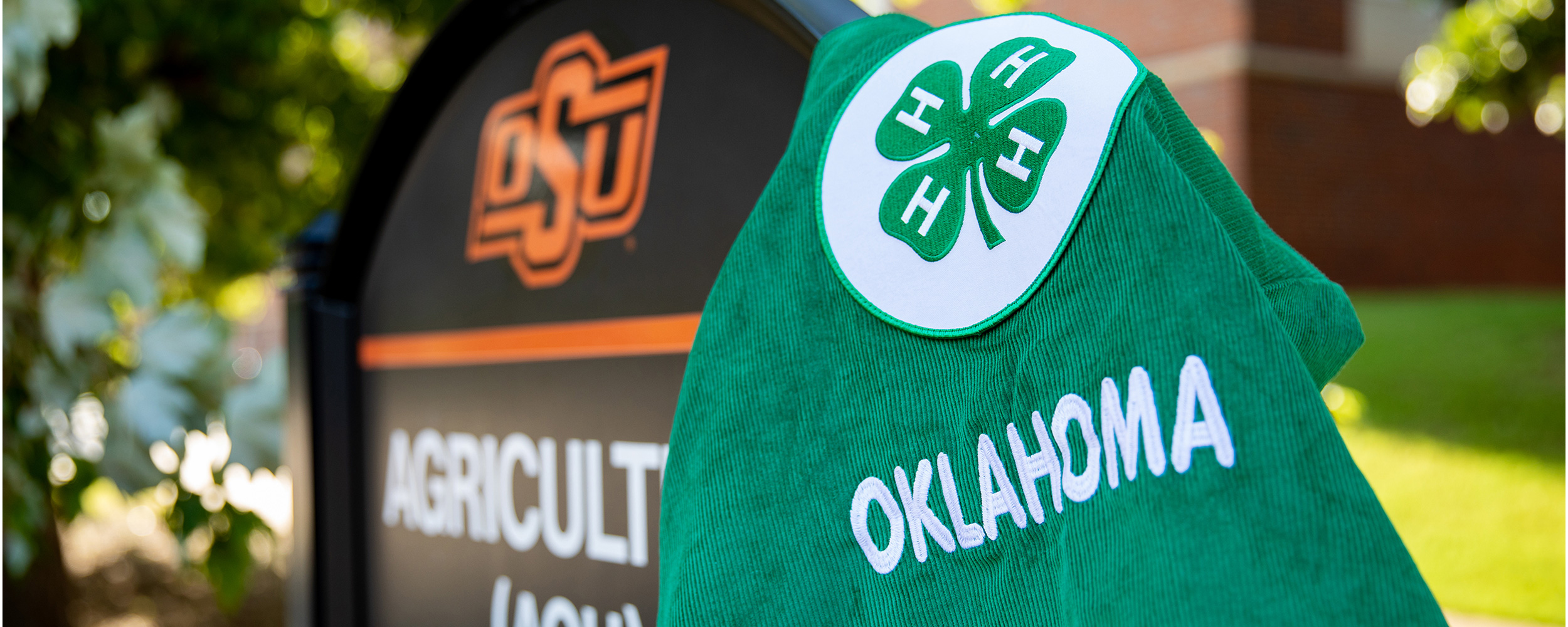 A 4-H jacket hangs on the Agriculture Hall sign.