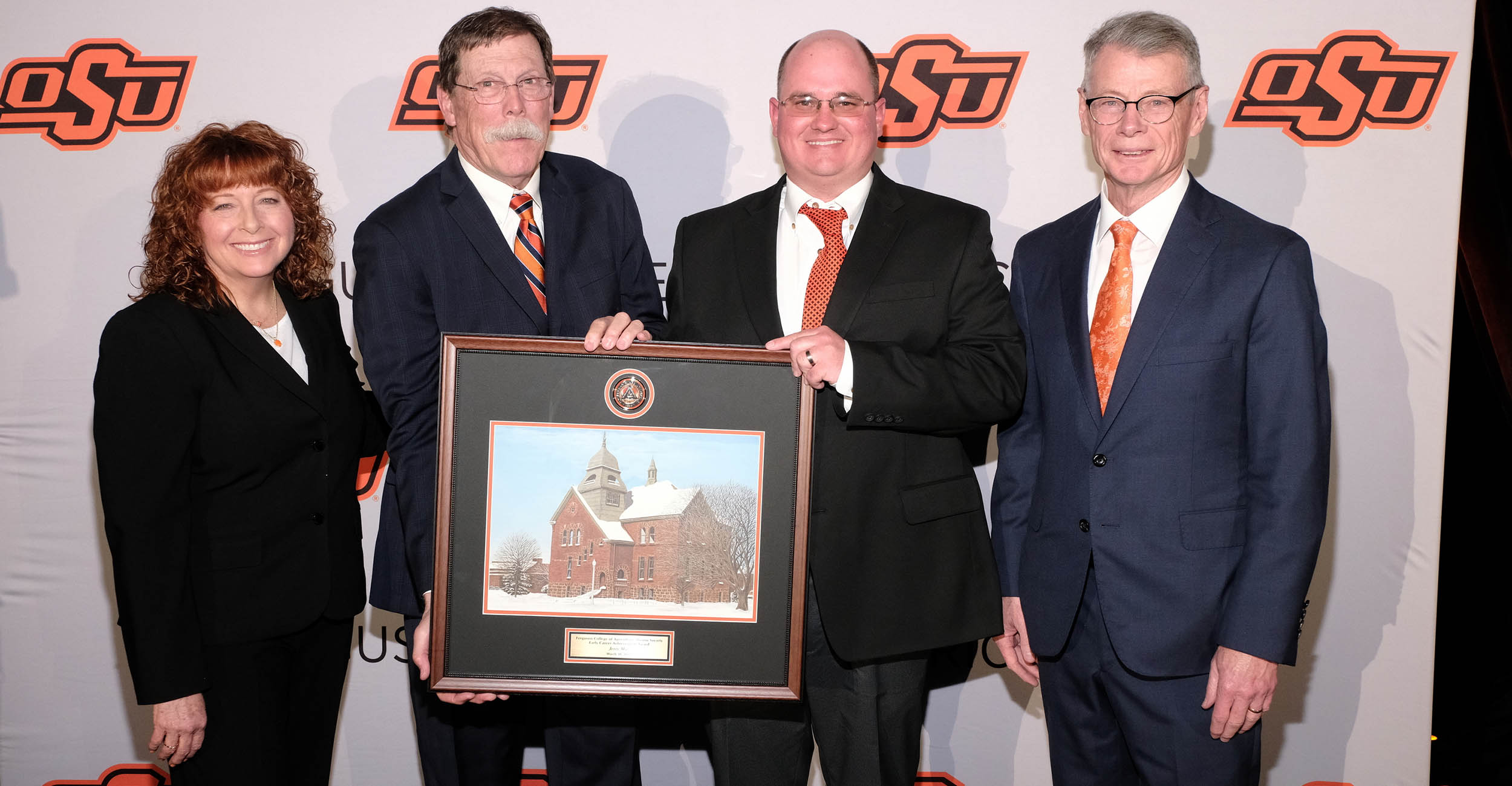 From left: Cynda Clary, associate dean of the Ferguson College of Agriculture; Rick Reimer, Ferguson College of Agriculture Alumni Society Board president; Jerry May; and Thomas G. Coon, vice president and dean of OSU Agriculture.