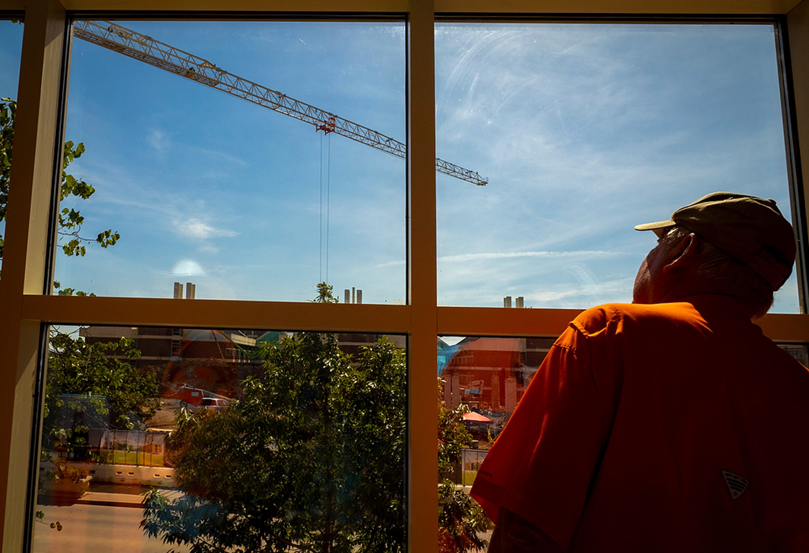 Man looks at crane