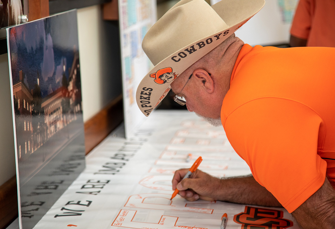 man signs banner