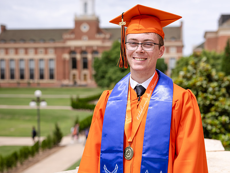 College of Arts and Sciences orange gown graduate prepares for career in Space Force