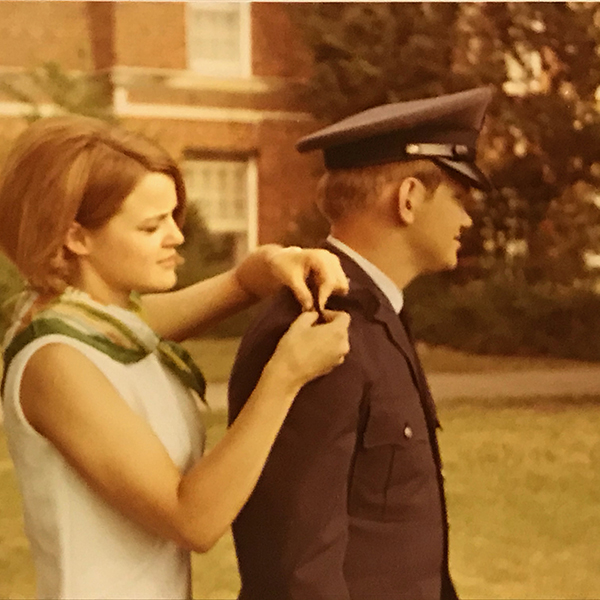 Beth Cupp pins gold bars on Ronn's Air Force uniform