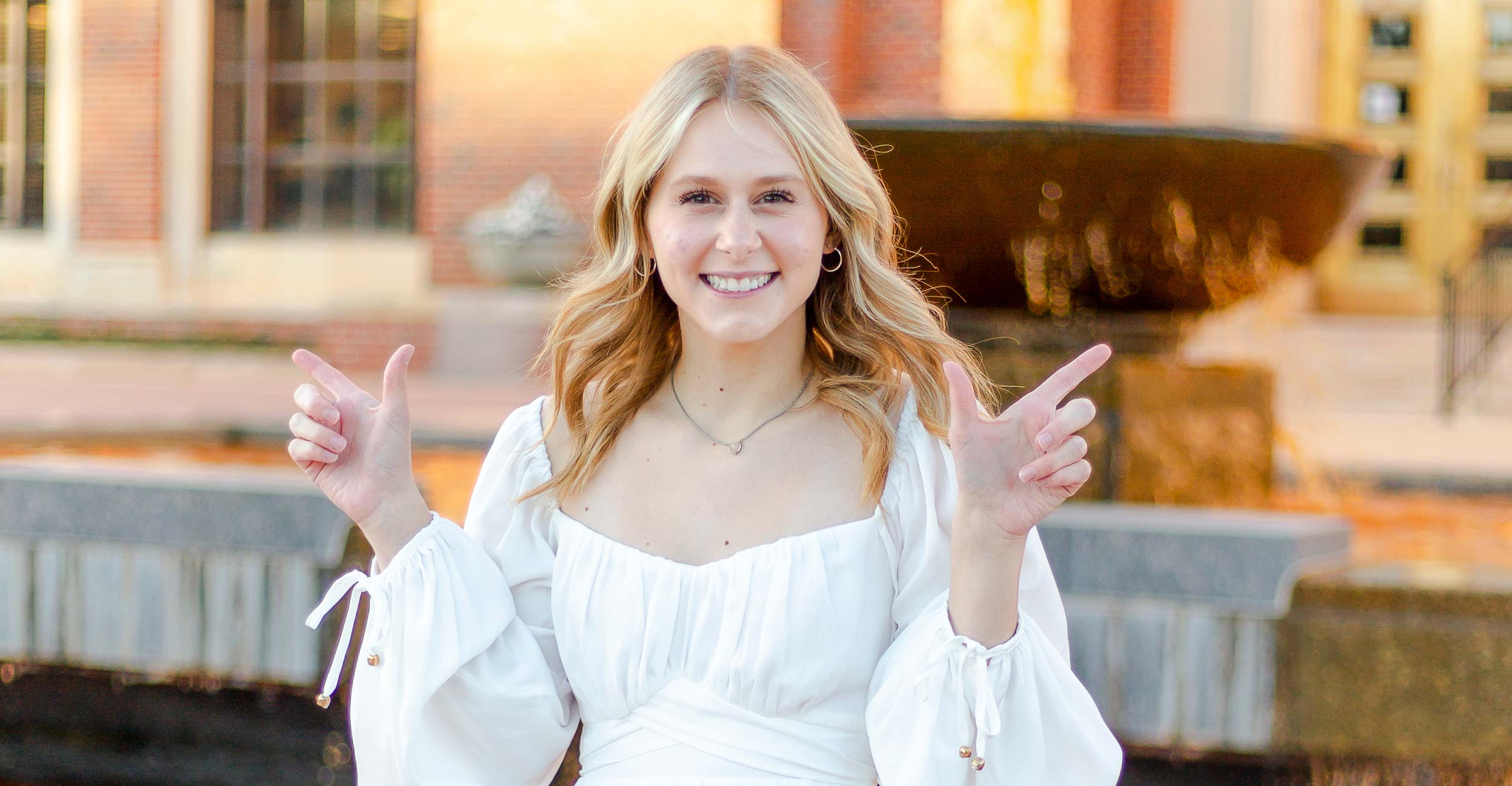 College of Arts and Sciences Orange Gown Graduate for Fall 2022, Liesl Melnick.