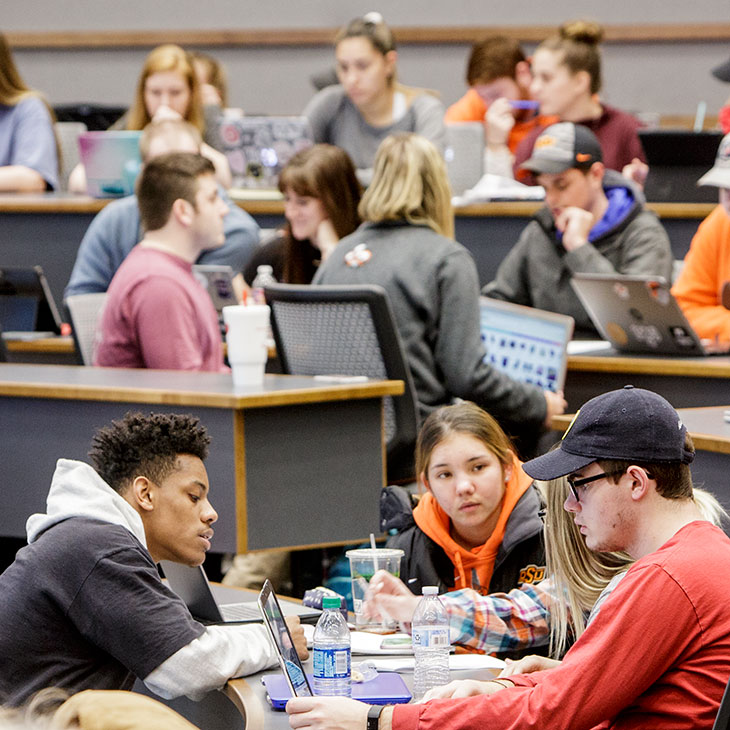 Students in Le Norman Auditorium