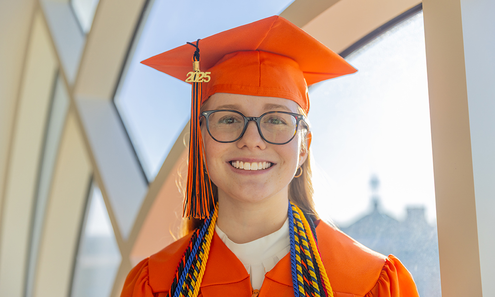 Amanda Hess wears her orange cap and gown.