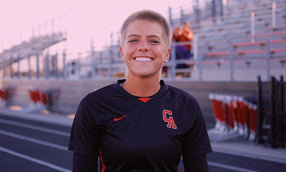 Brooklyn Hawkins a teenage girl with short hair smiles at the camera