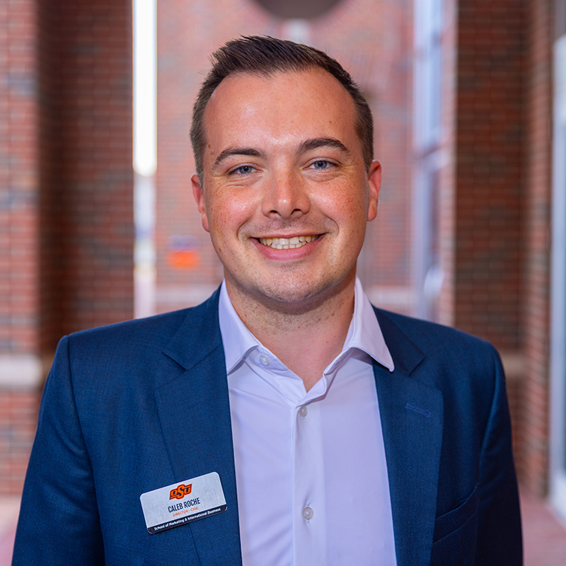 Professional headshot of Caleb Roche