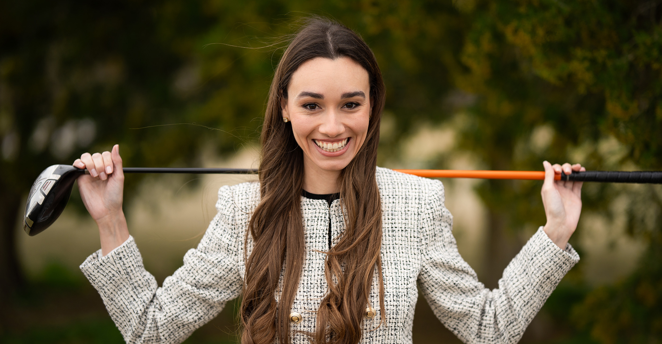 Carina Cuculiza poses with a golf club at Stillwater Country Club.