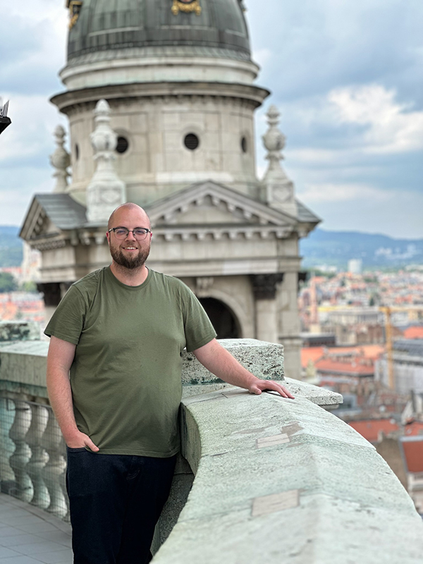 Chris Neil poses among Central European architecture.