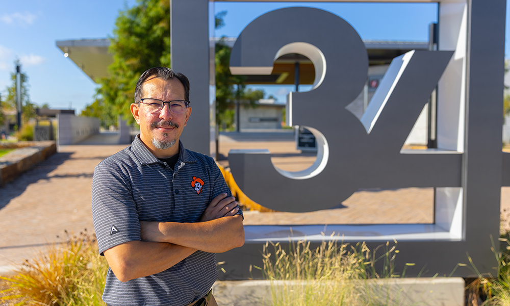 Chris Franklin in front of the Block 34 sign