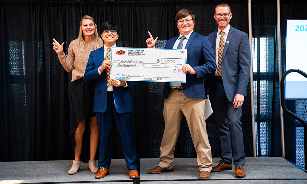 Cristian and Jackson Cristian Mendoza and Jackson Seiler hold their prize check.