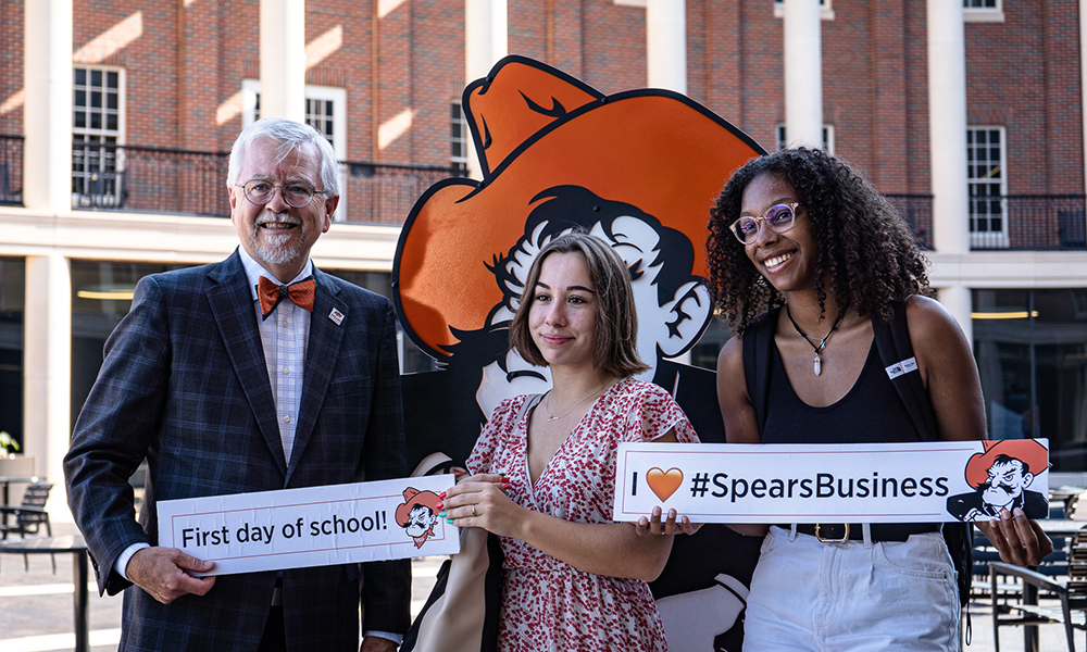 Dr. Ken Eastman poses with students on the first day of school.