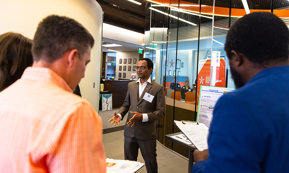 Student presenting A student presents a business idea to a panel of judges.