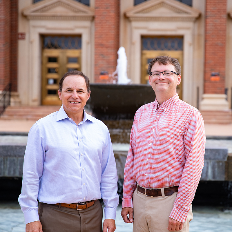 Dr. Edwards and Dr. Crick standing in front of OSU's Edmon Low Library.