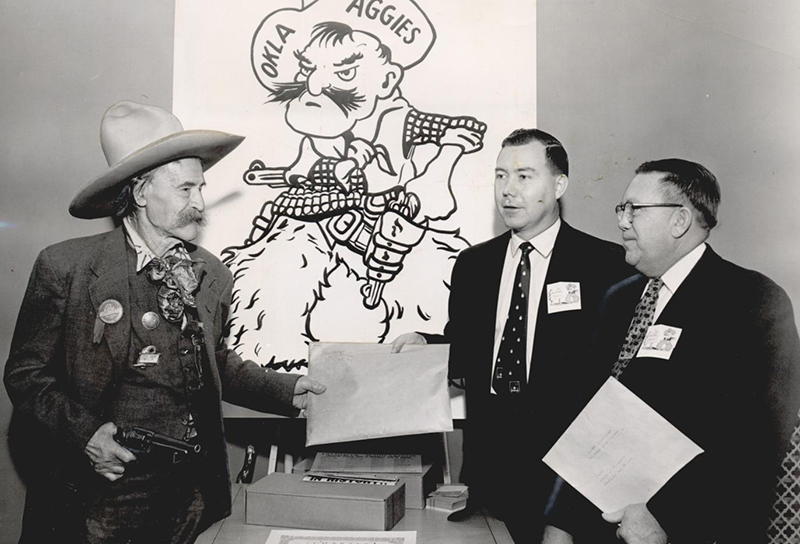 Frank Eaton draws his famous revolver at Oklahoma State University.