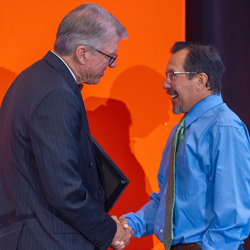 Chris Franklin shakes hands with OSU president Dr. Jim Hess.