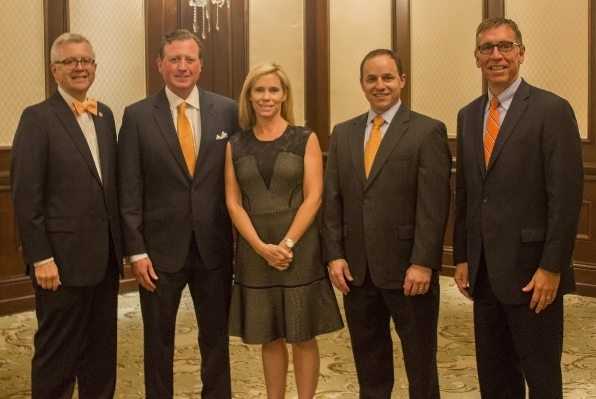 Dean Ken Eastman (left) and Bryan Edwards and Andy Urich congratulate Joseph and Monica Eastin.