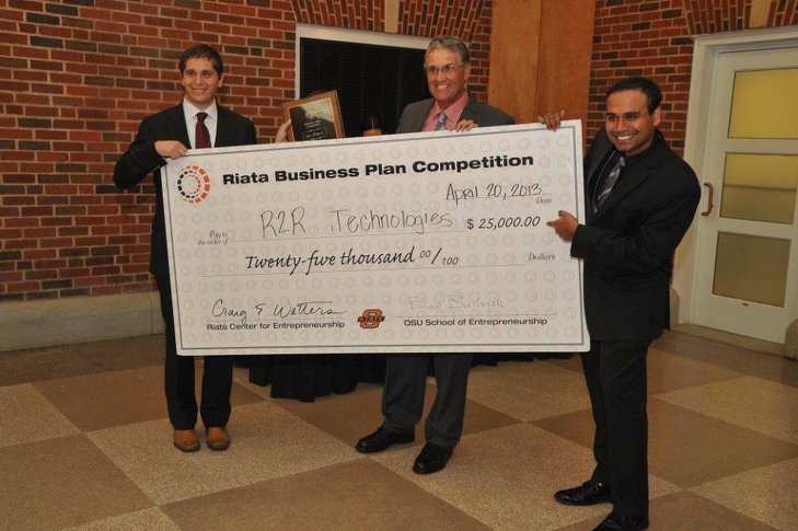 R2R Technologies was awarded a $25,000 check after winning first place in the Annual Riata Business Plan Competition. R2R Technologies team members, from left, are OSU students Carlo Branca, Aravind Seshadri and Pedro Velasco.