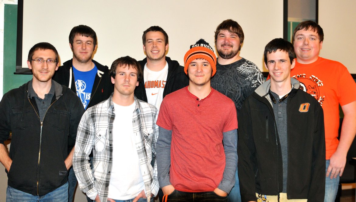 Information Security Assurance Club (ISAC) students (front row) Steven Haddock, Michael Smith, David Waters, Corey Hadley, (back row) Chase Freeman, Zach Taylor, Clayton Griffith, and Eric Osmus, compete in eight-hour virtual cyber defense competition, advancing them to regional competition in Marc