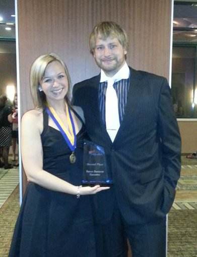Oklahoma State University students Megan Melot (left), accounting major, places second in the Future Business Executive competition and was elected PBL National Treasurer with the help of her campaign manager, Aaron Barker (right), general business major, at the FBLA-PBL National Leadership Conference.