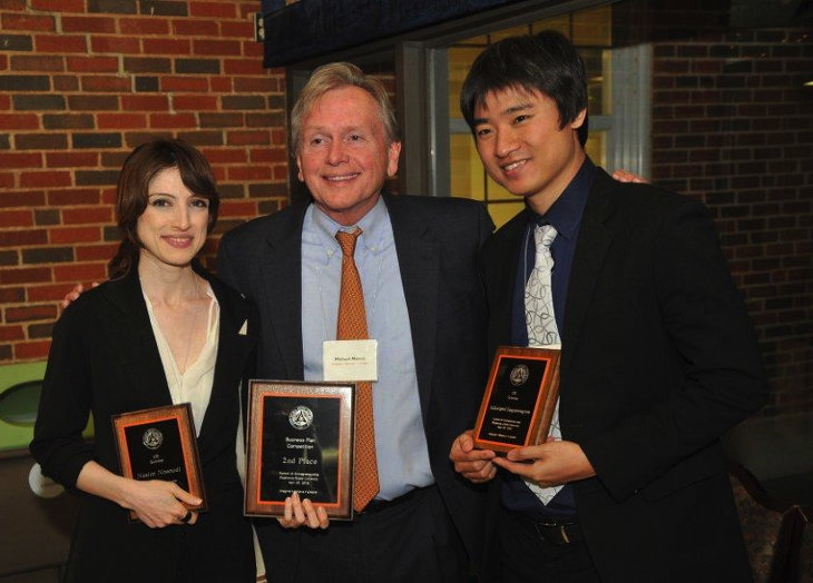 Medishine was awarded $10,000 for capturing second place in the annual Riata Business Plan Competition. School of Entrepreneurship professor Mike Morris, center, presents Medishine members Nasim Nosoudi and Akkarapol Sangasoongsong with their second-place awards.