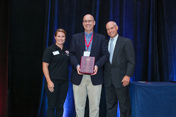 J Riley Shaw (middle) was honored as a National Outstanding Beta Alpha Psi Faculty Advisor at the American Accounting Association.