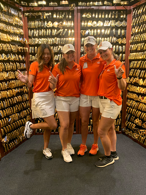Jenna Solheim and the Cowgirl Golf team in the PING putter vault.
