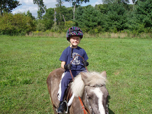 Katie Schell got an early start on riding horses.