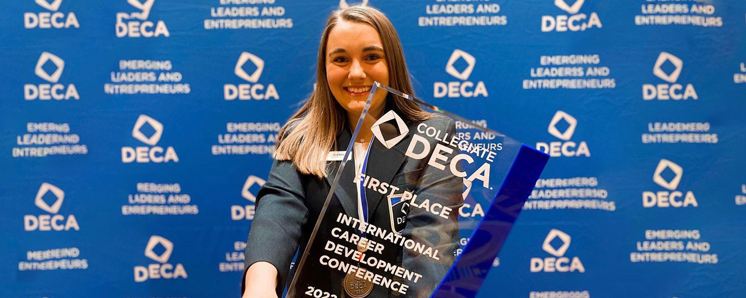 Kyla Ellis, Spears HTM junior with her first place trophy for the International DECA Competition