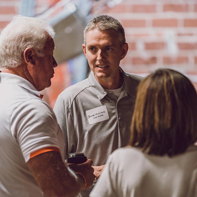 Jerod Millirons speaking with customers at Iron Monk Brewery in Stillwater.