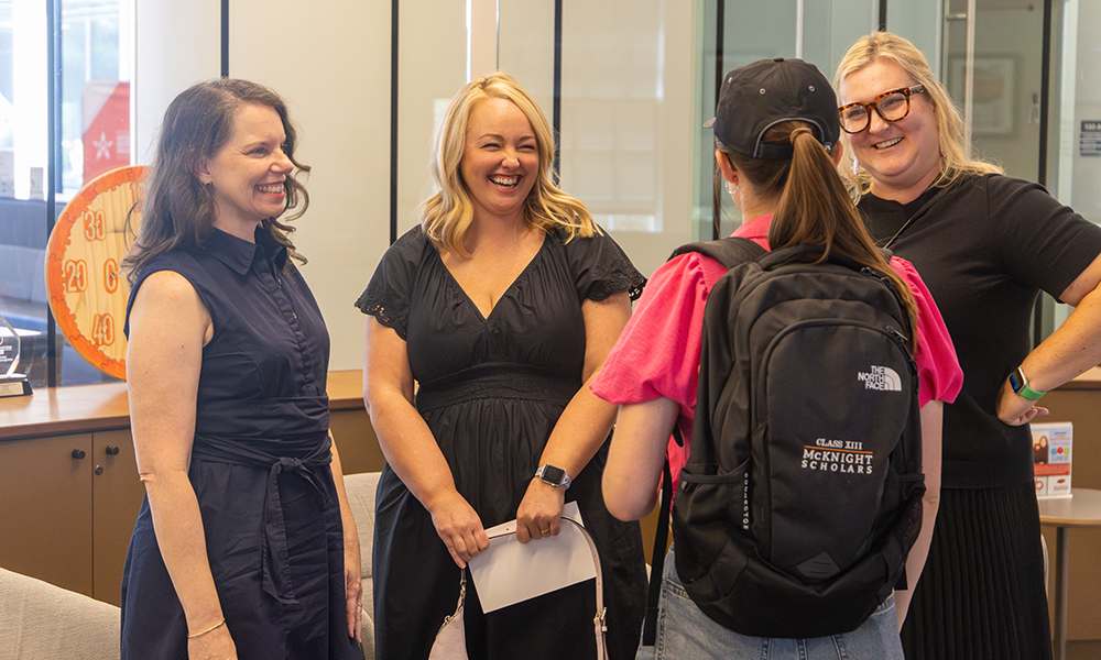 Pie Junkie entrepreneurs chat with a student.