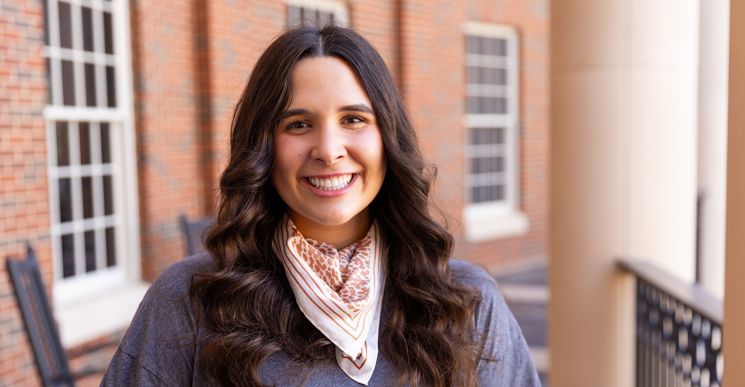 RachelKate Puckett on the balcony of the Business Building.