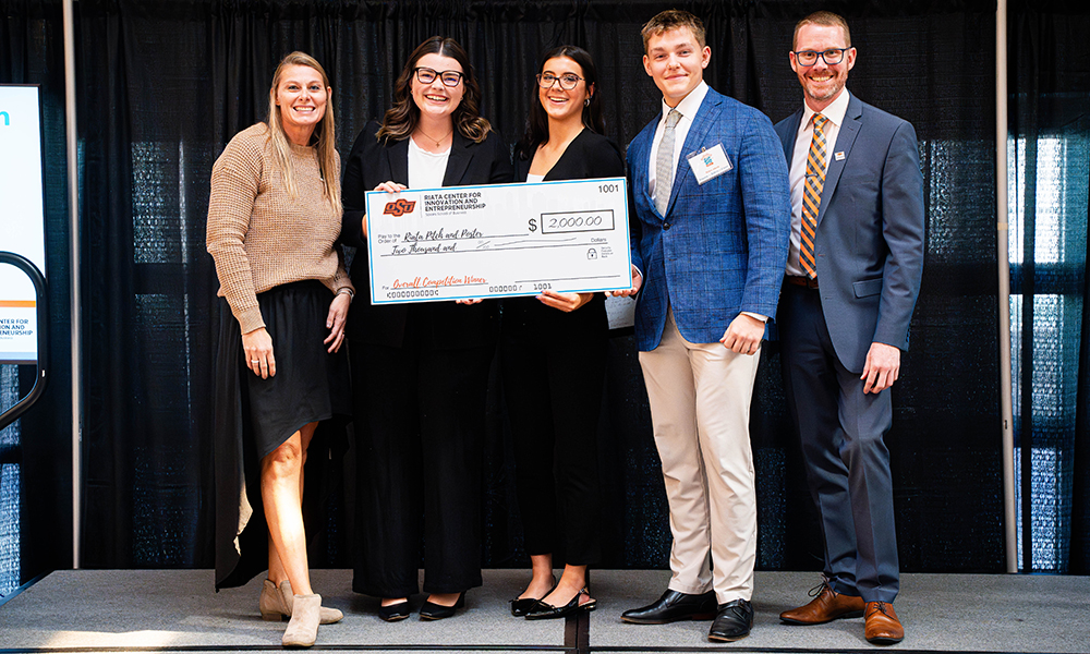 Snap Footwear winners Snap Footwear team members accept their prize check.