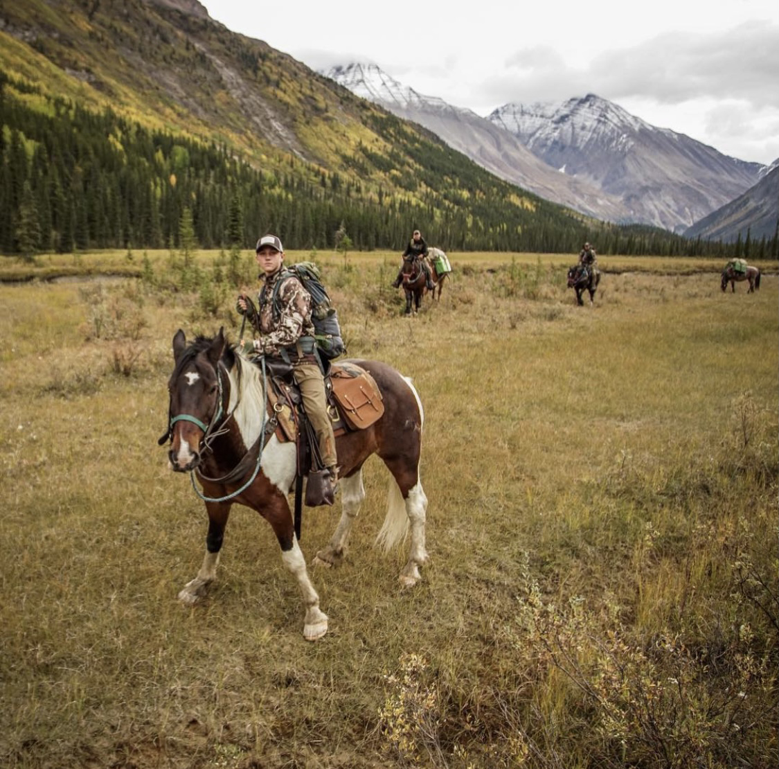 Tapp and his crew riding horseback to their next hunting location. 