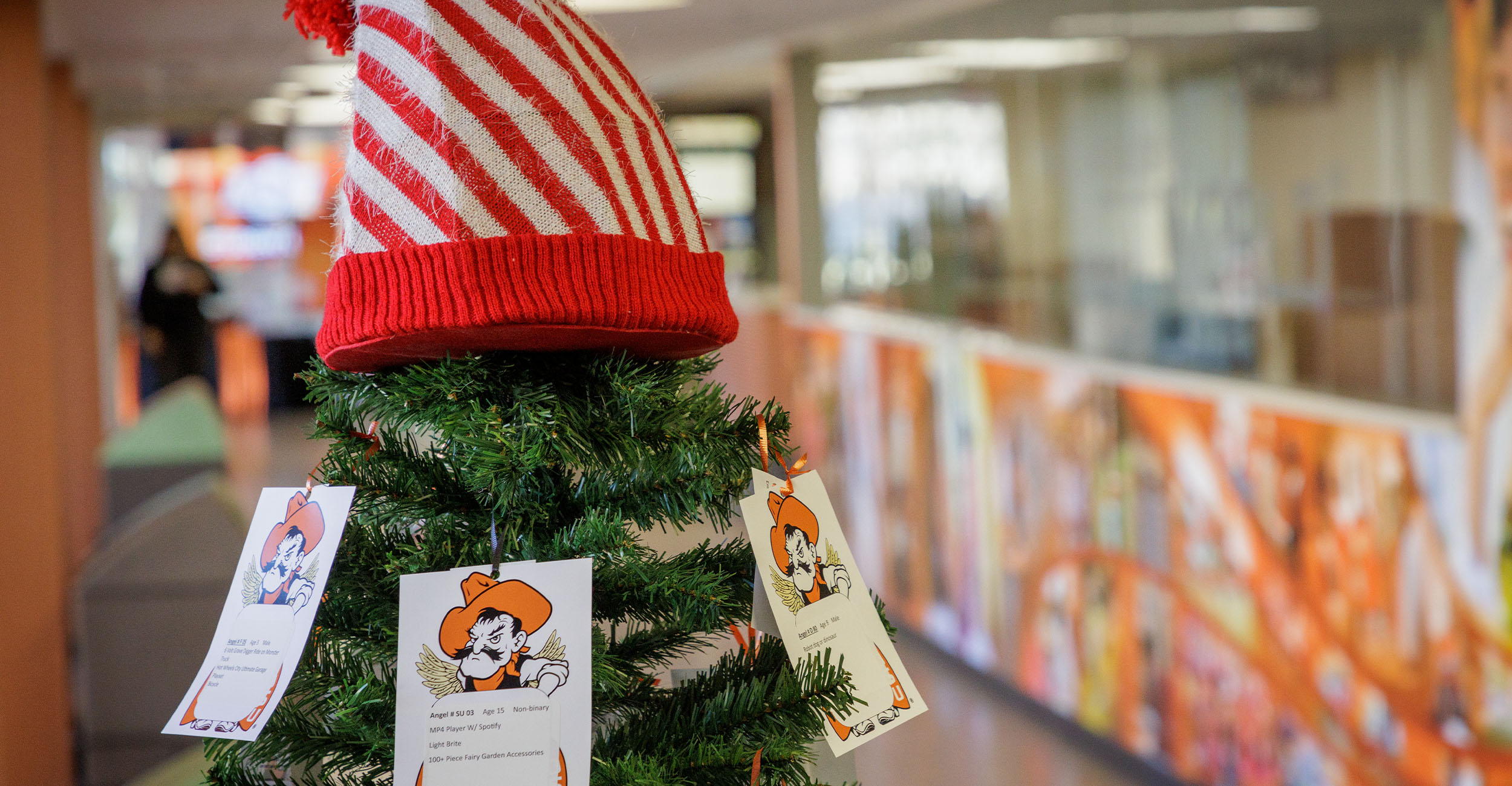 The top of OSU's Angel Tree with the Campus Life offices in the background.
