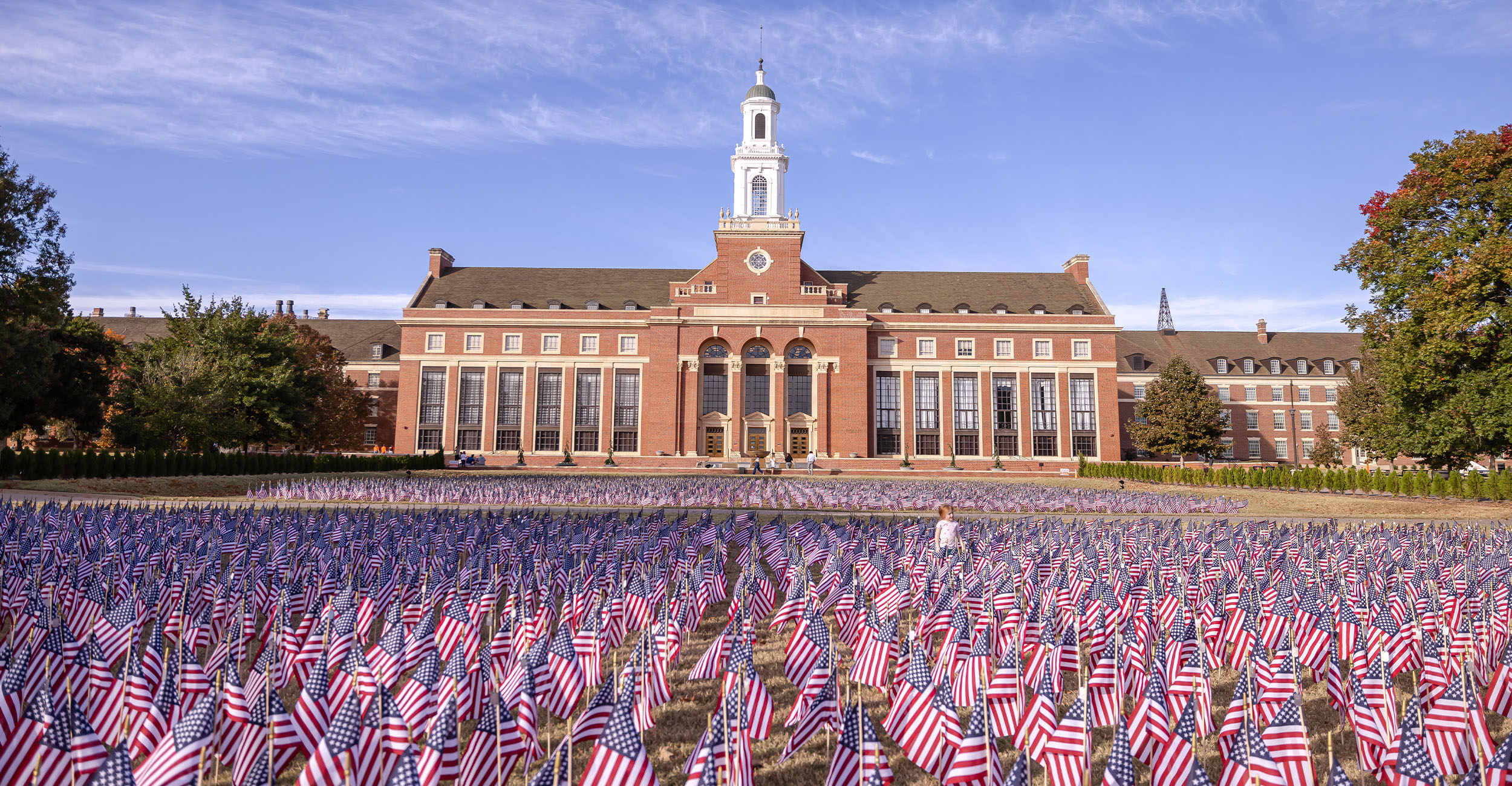 Edmon Low Library in the background with a sea of American flags in the foreground.