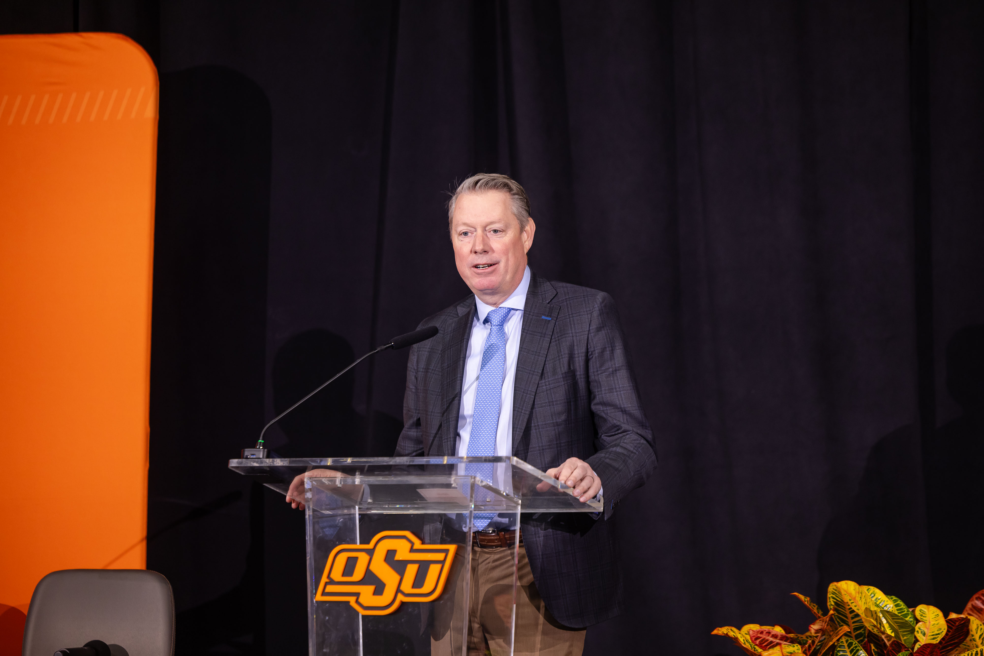 Jayson Lusk speaks from a podium