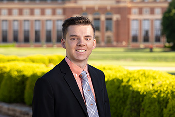 Cody Moss, a premedical nutritional sciences major at Oklahoma State University, stands on campus after being named a 2026 Obama-Chesky Voyager Scholar, a national scholarship recognizing students committed to public service.