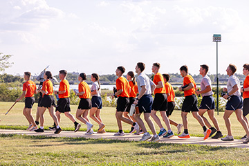 Oklahoma State University Air Force ROTC cadets run in formation during the annual 24-hour POW/MIA remembrance relay around Boomer Lake, a tradition honoring the sacrifices of missing and captured U.S. service members.