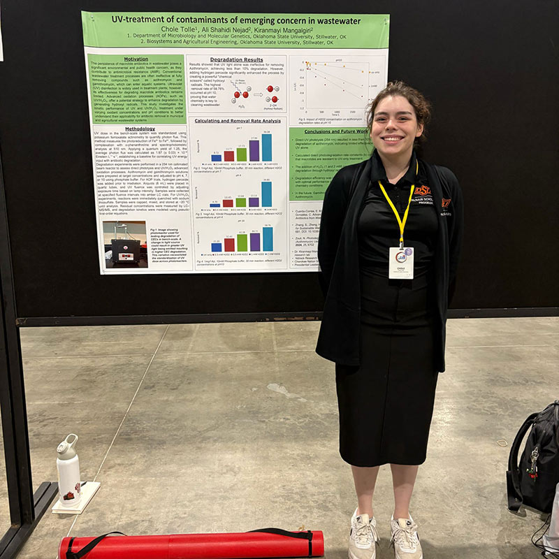 Chole Tolle, a microbiology, cell and molecular biology student presents her research poster. 