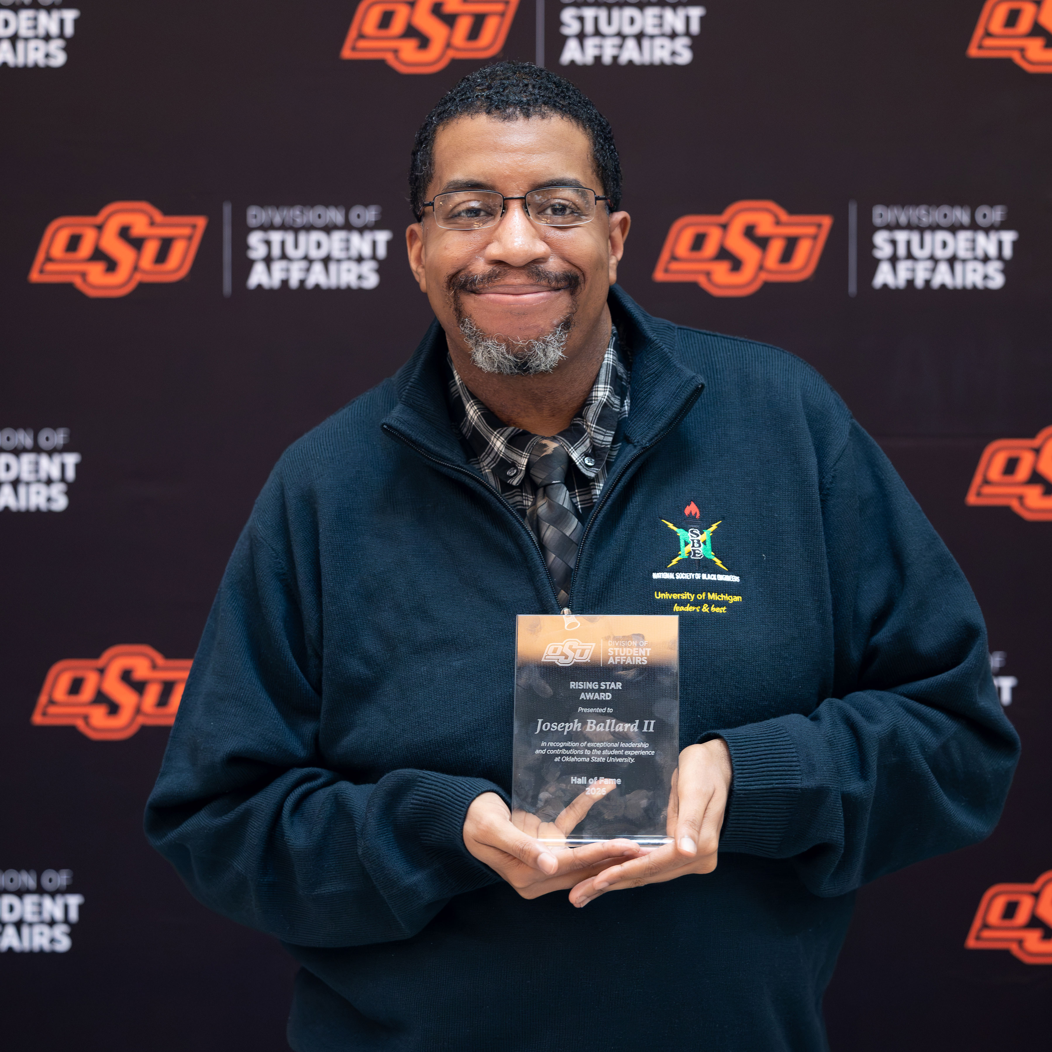 Joseph Ballard II with an award