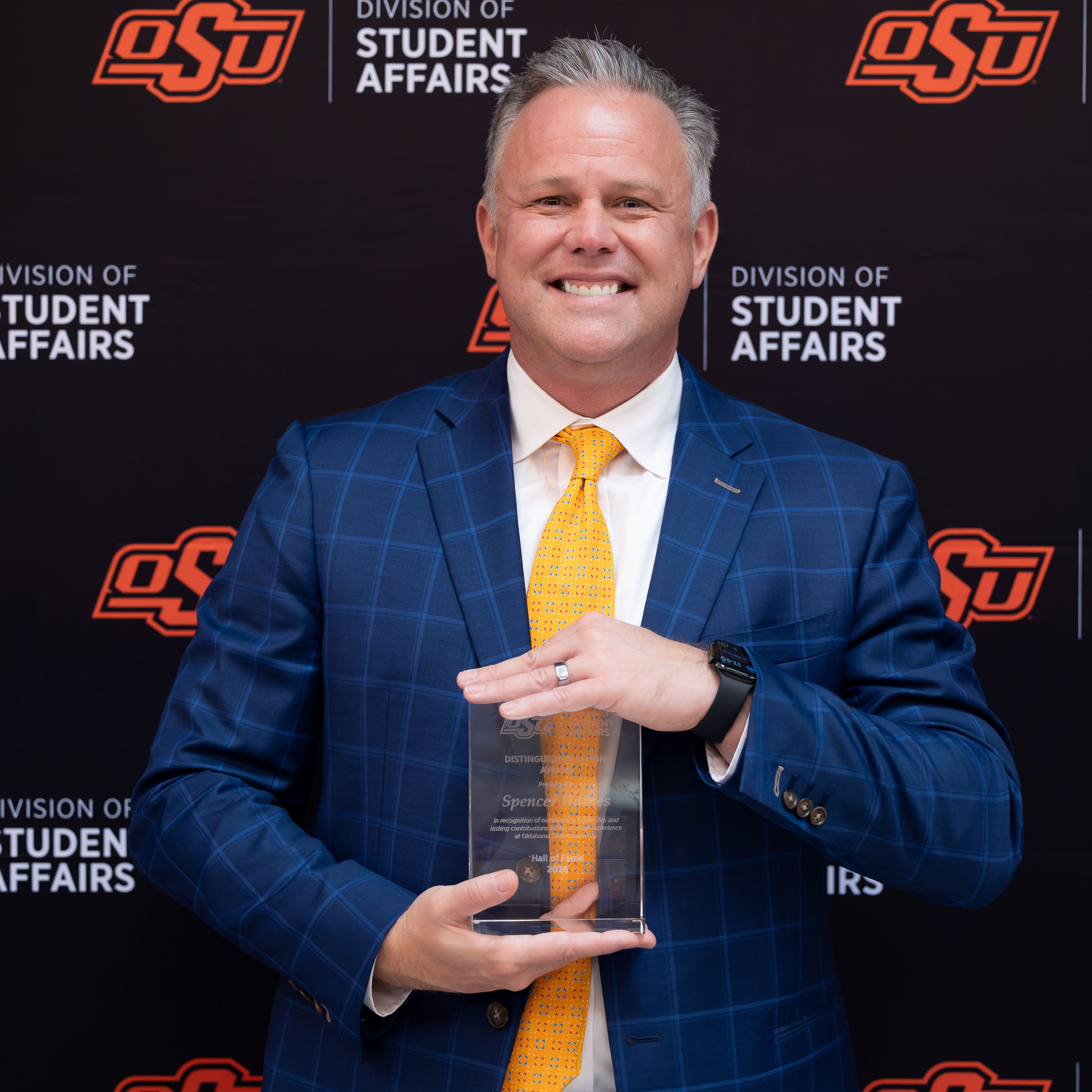 Spencer Haines with an award