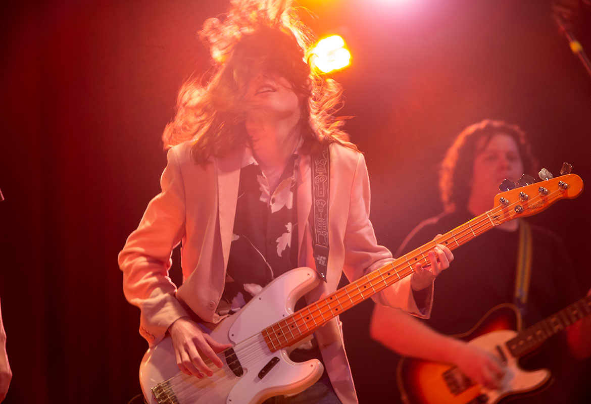 Student playing bass at the battle of the bands