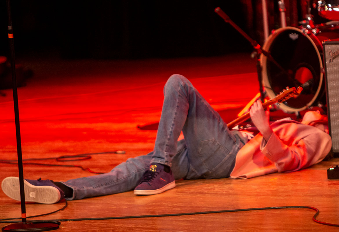 Student playing bass at the battle of the bands