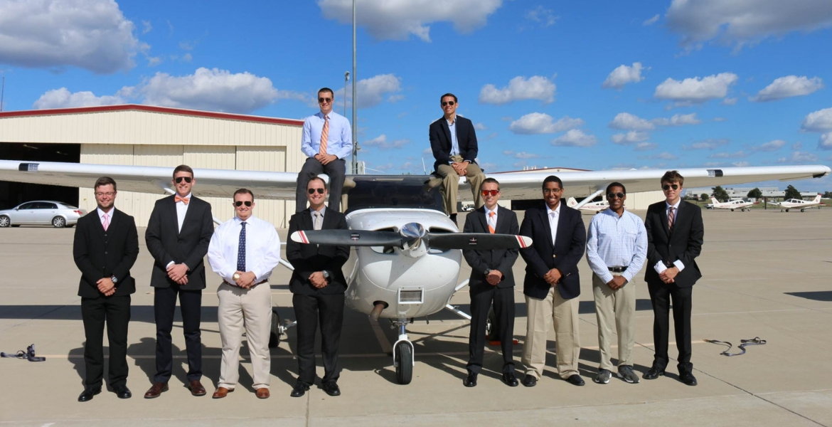 The 2016 Flying Aggies with their plane